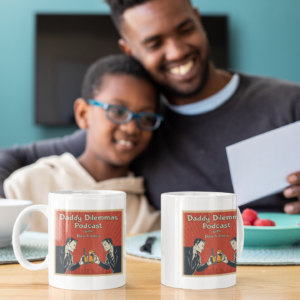 mockup of two mugs placed in front of a dad and his son 33114.png